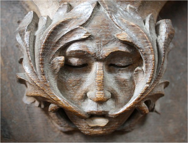 Green man/foliate head from St Mary’s Church Adderbury. Image credit: Richardr, 2011.